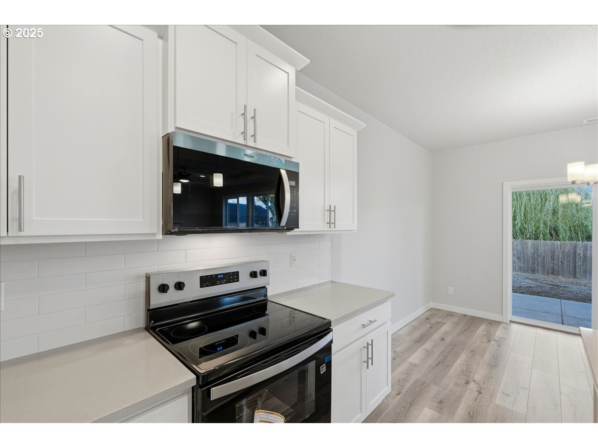 405 South Cedar Street Yamhill, OR 97148 - Photo 14 of 36 a kitchen with a stove and a microwave