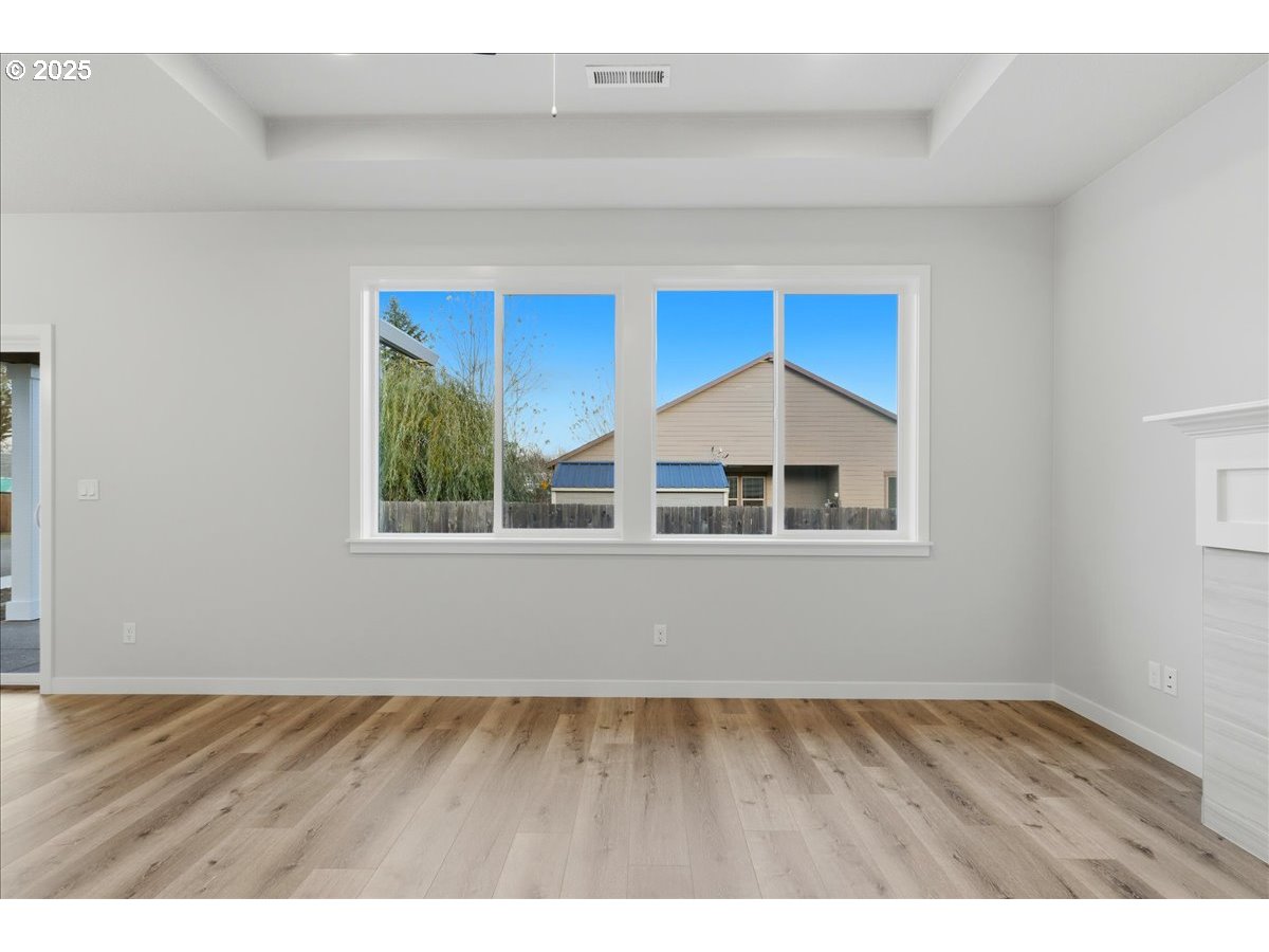 405 South Cedar Street Yamhill, OR 97148 - Photo 25 of 36 a view of an empty room with wooden floor and a window