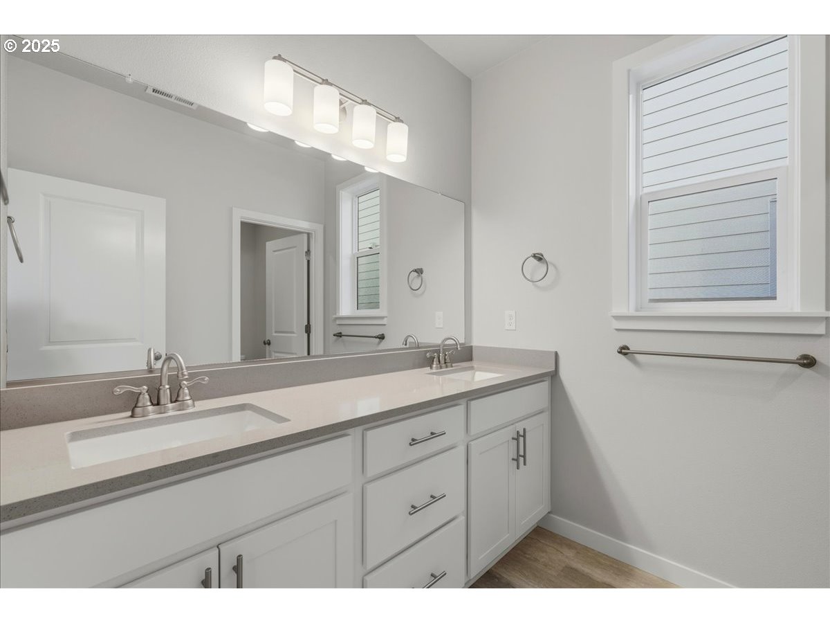 405 South Cedar Street Yamhill, OR 97148 - Photo 28 of 36 a bathroom with a double vanity sink and a mirror