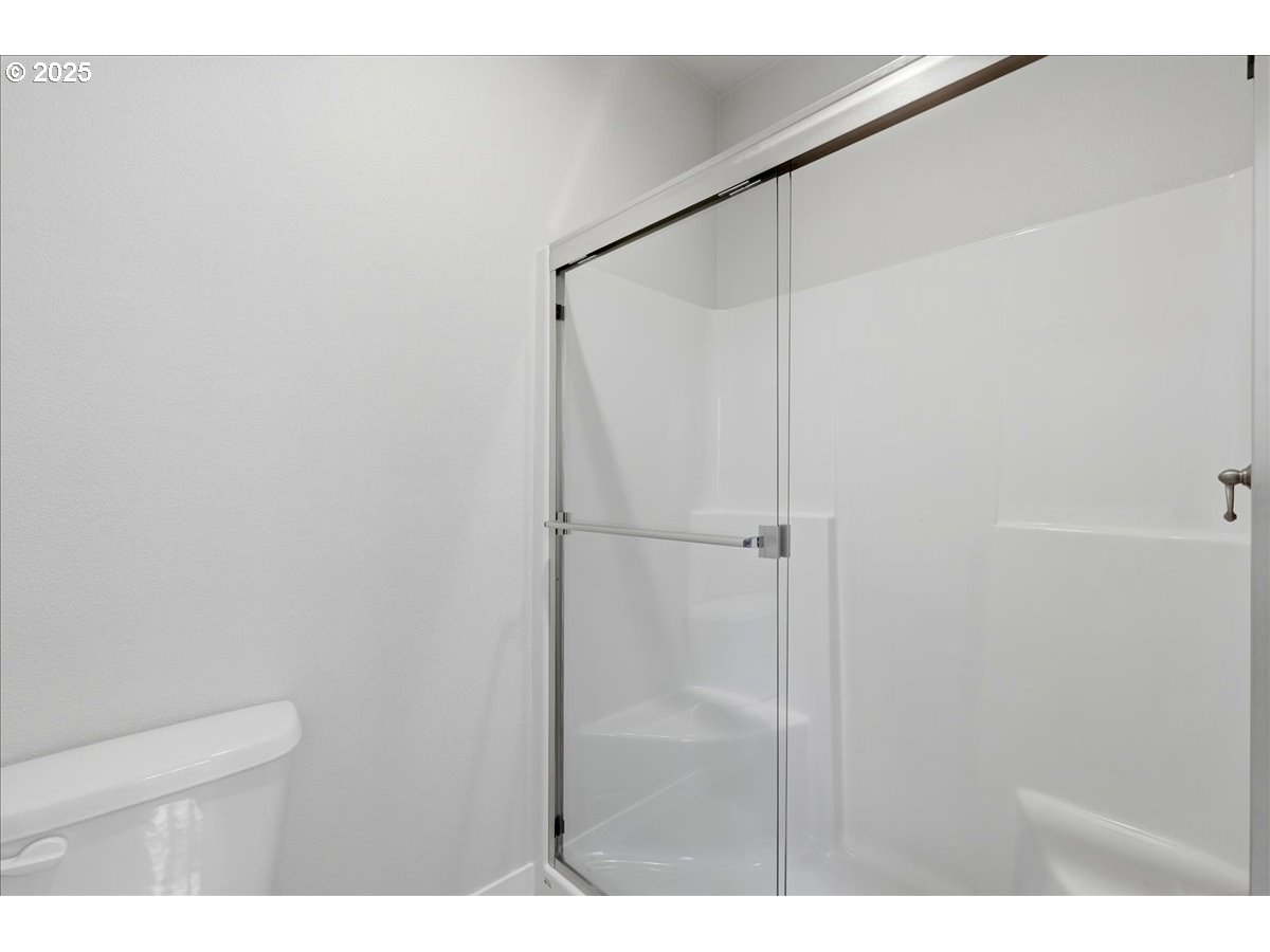 405 South Cedar Street Yamhill, OR 97148 - Photo 29 of 36 a bathroom with a shower and a toilet