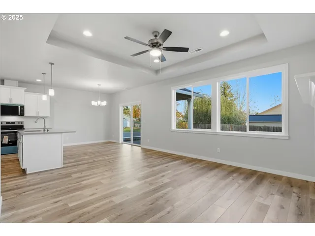 a view of kitchen with wooden floor