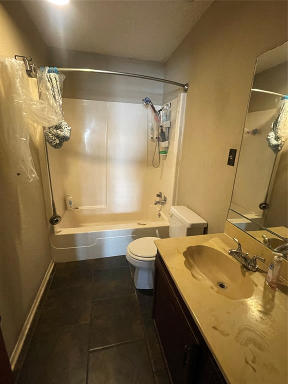 814 Plum Street Graham, TX 76450 - Photo 14 of 25 a bathroom with a granite countertop sink toilet and shower