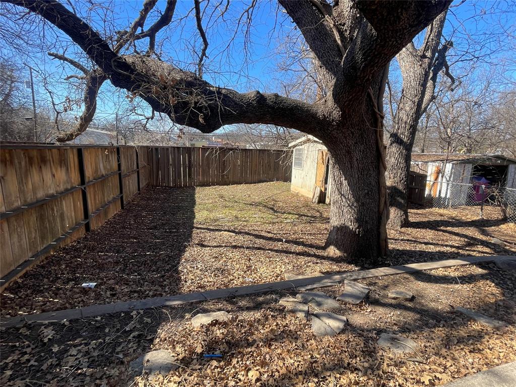 814 Plum Street Graham, TX 76450 - Photo 16 of 25 a view of a backyard of the house