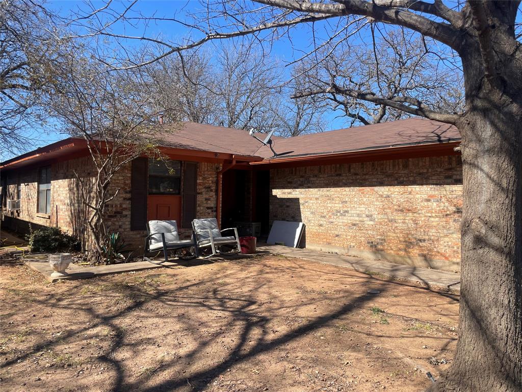 814 Plum Street Graham, TX 76450 - Photo 2 of 25 a view of a house with a patio