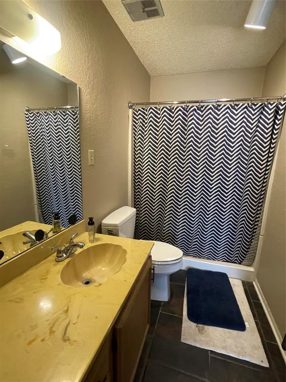 814 Plum Street Graham, TX 76450 - Photo 25 of 25 a bathroom with a sink and a toilet