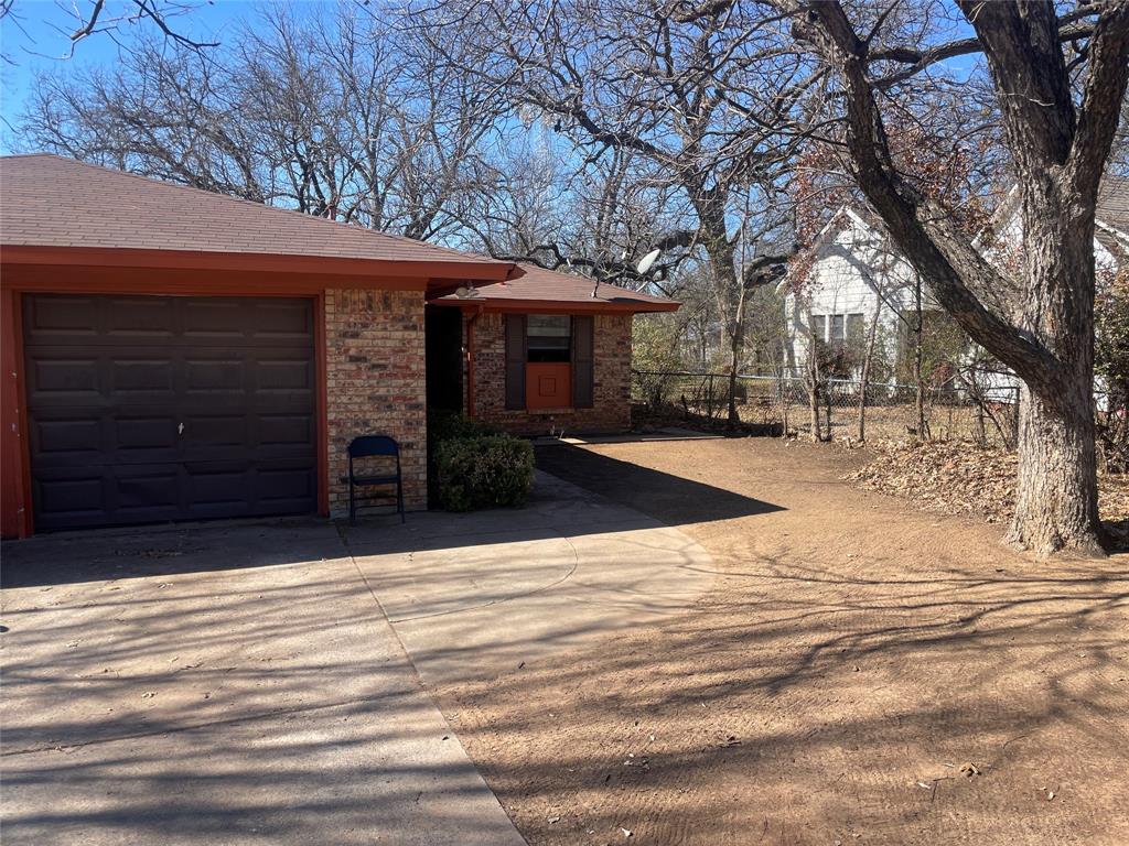 814 Plum Street Graham, TX 76450 - Photo 3 of 25 a view of a house with a yard