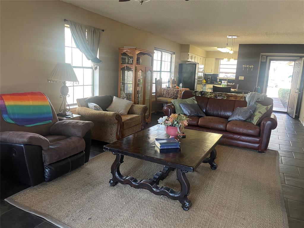 814 Plum Street Graham, TX 76450 - Photo 5 of 25 a living room with furniture and a window