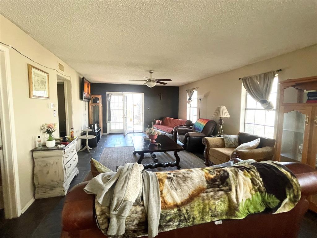 814 Plum Street Graham, TX 76450 - Photo 6 of 25 a living room with furniture and a large window