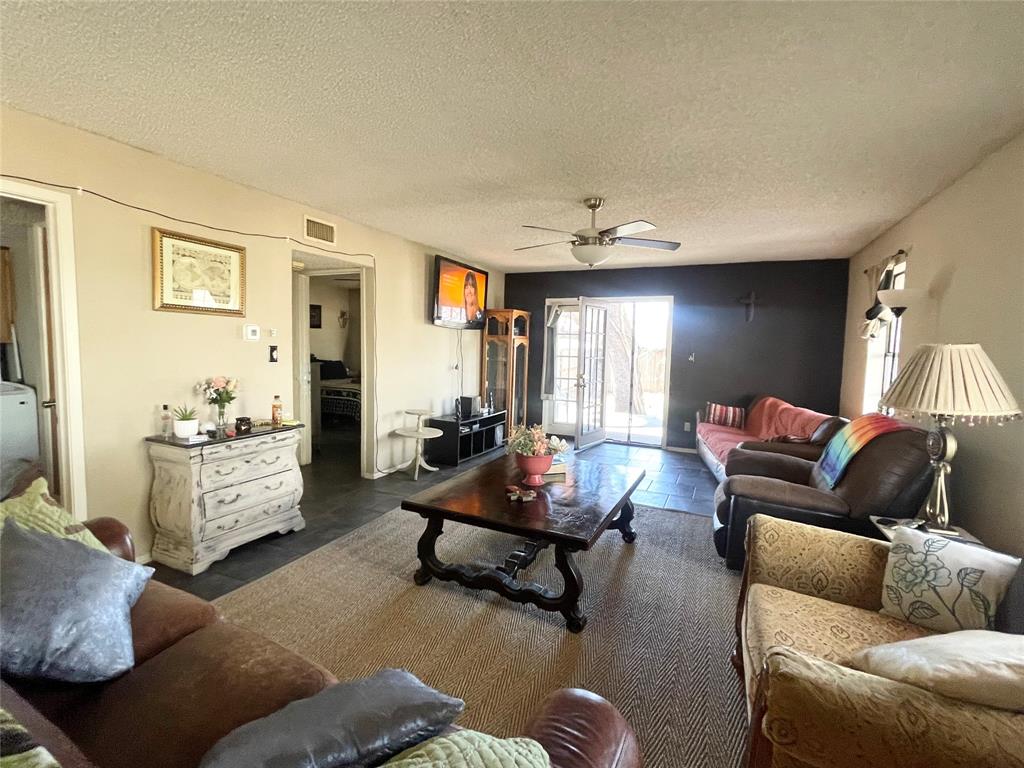 814 Plum Street Graham, TX 76450 - Photo 7 of 25 a living room with furniture and a couch