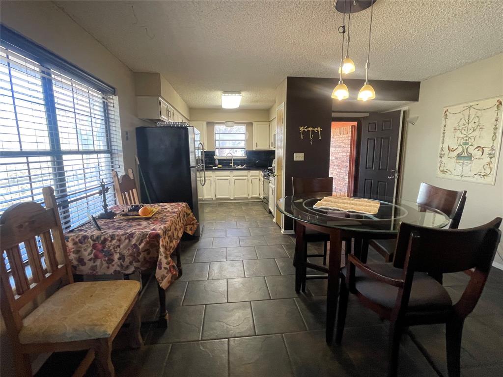 814 Plum Street Graham, TX 76450 - Photo 9 of 25 a view of a dining room with furniture