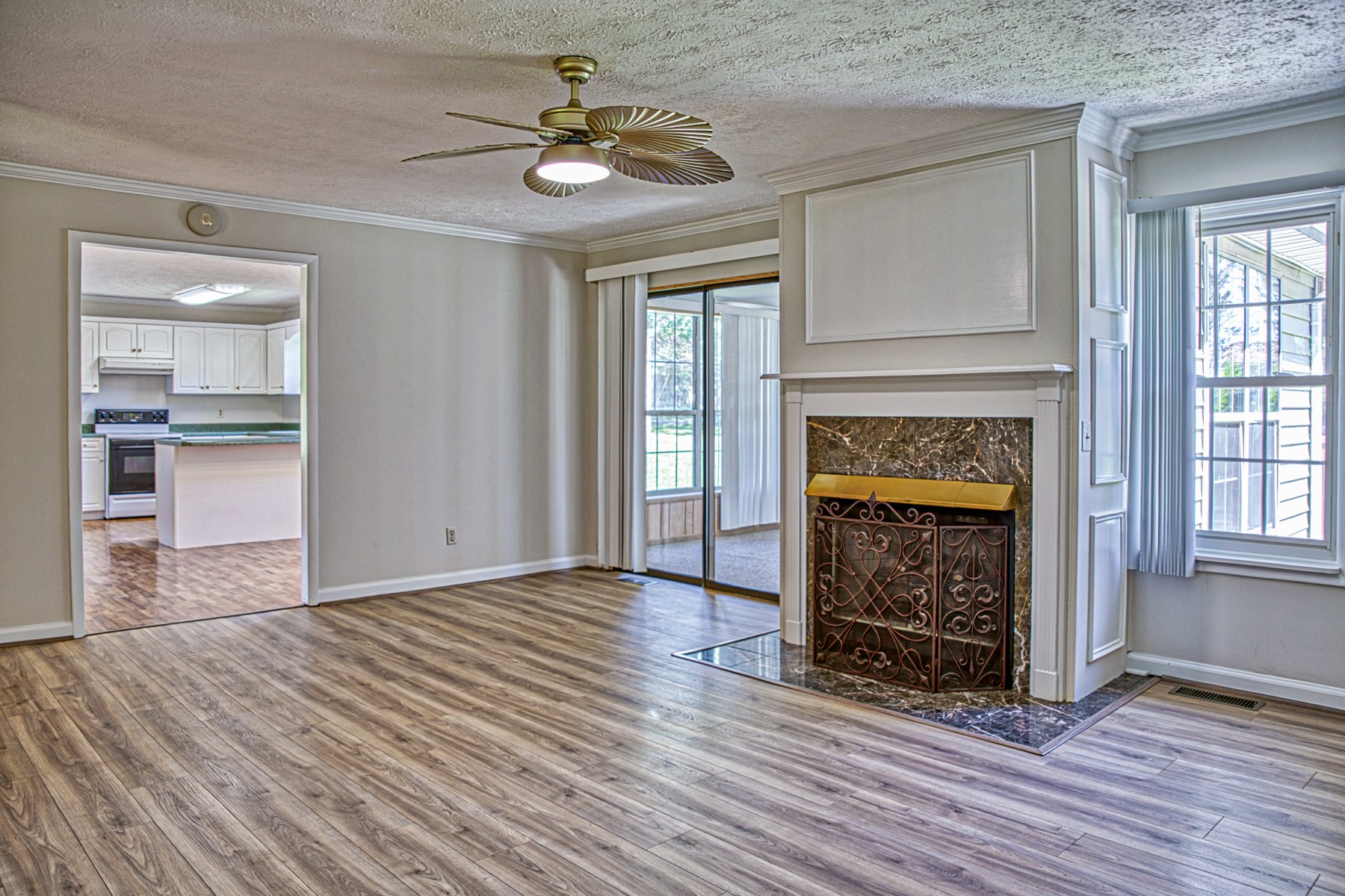 2085 Herbert Garrett Road Cookeville, TN 38506 - Photo 15 of 39 a view of an empty room with wooden floor fireplace and a window
