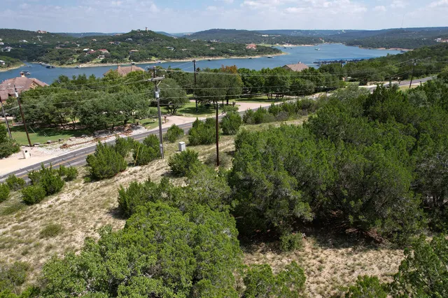 an aerial view of residential house with outdoor space and river