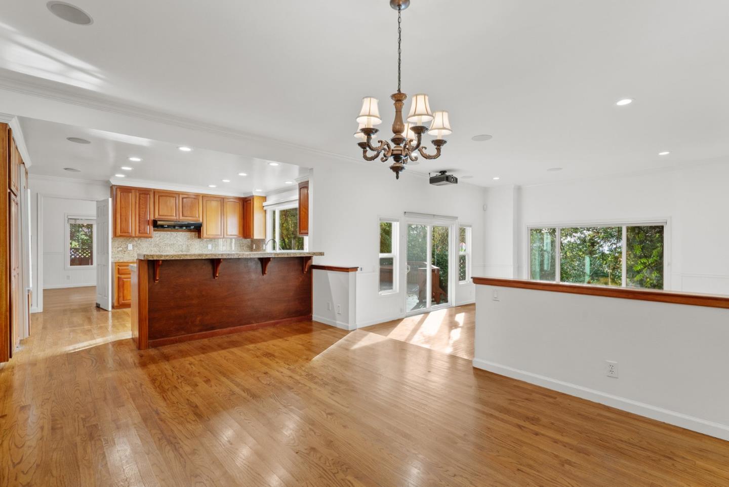210 Moore Creek Road Santa Cruz, CA 95060 - Photo 11 of 63 a view of a kitchen with a dishwasher cabinets and a chandelier