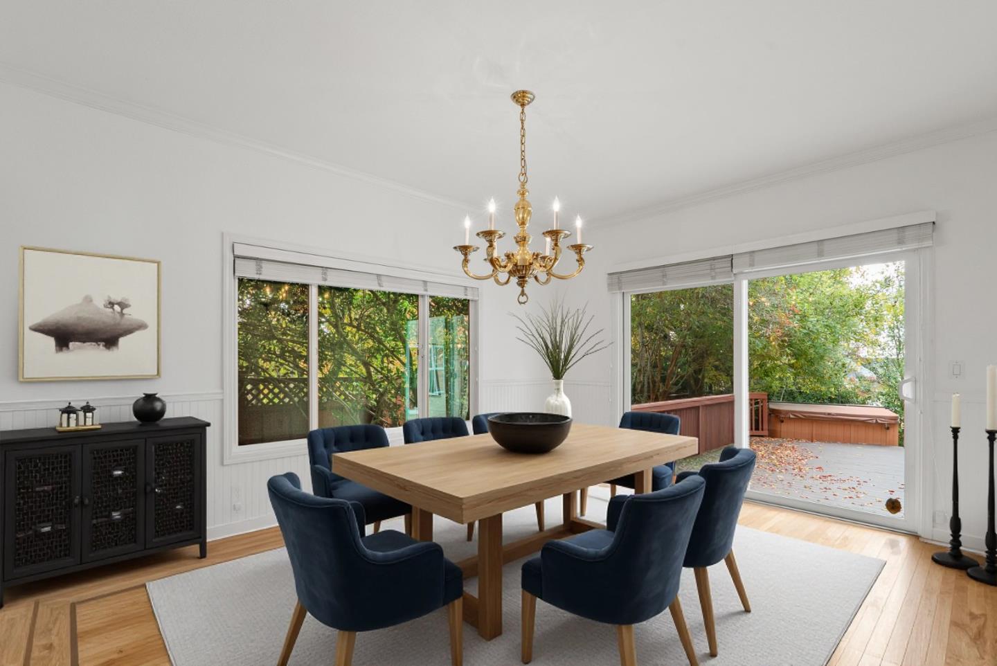 210 Moore Creek Road Santa Cruz, CA 95060 - Photo 20 of 63 a view of a dining room with furniture large windows and wooden floor