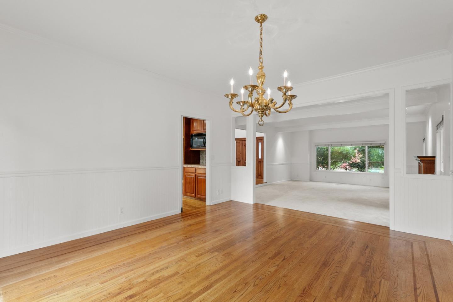 210 Moore Creek Road Santa Cruz, CA 95060 - Photo 21 of 63 a view of a room with chandelier and wooden floor