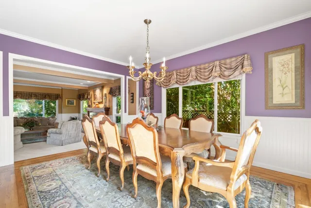 a bed room with a bed and a painting on the wall