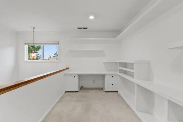 a view of an empty walk in closet