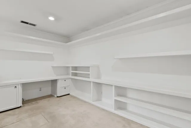 a bathroom with a tub a double vanity sink and mirror