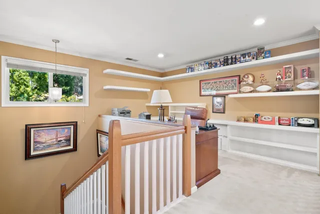 a living room with furniture a large window and a flat screen tv