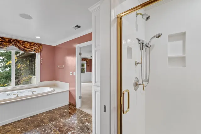 a bathroom with a sink a toilet and a large mirror