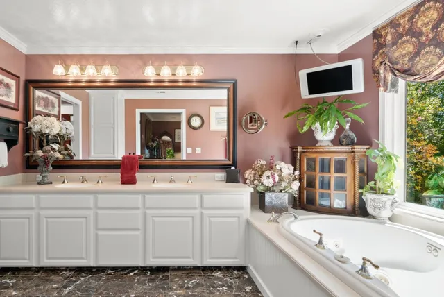 a bathroom with a granite countertop sink a toilet and a bathtub