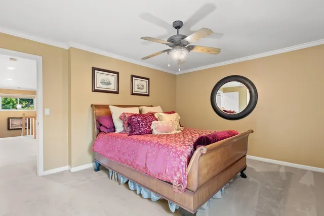a balcony with wooden floor table and chairs
