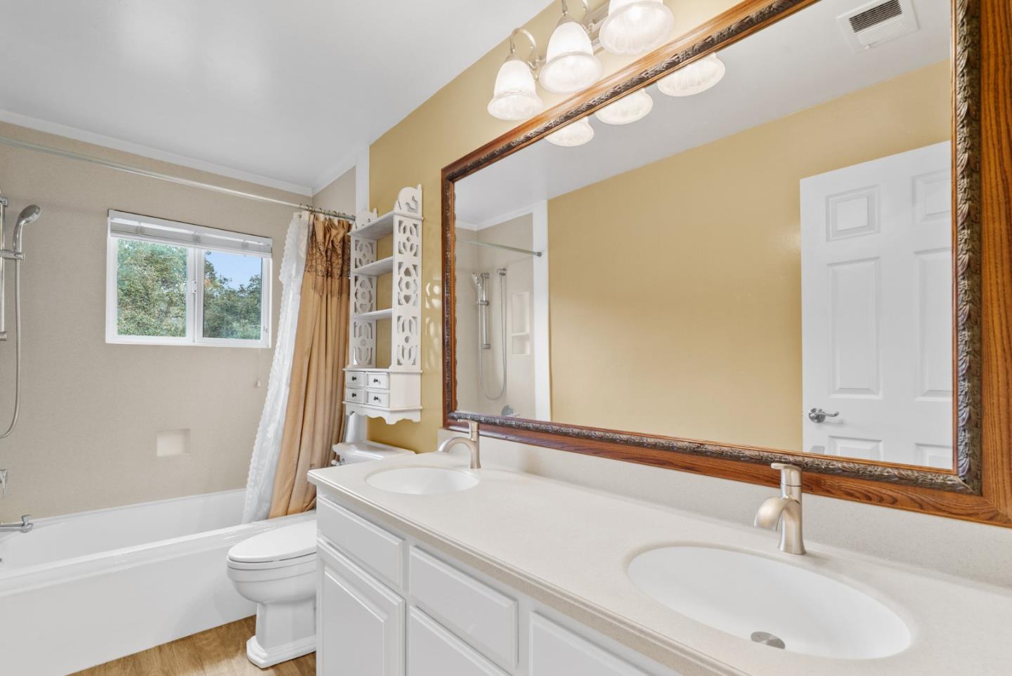210 Moore Creek Road Santa Cruz, CA 95060 - Photo 40 of 63 a bathroom with a sink a toilet and a large mirror