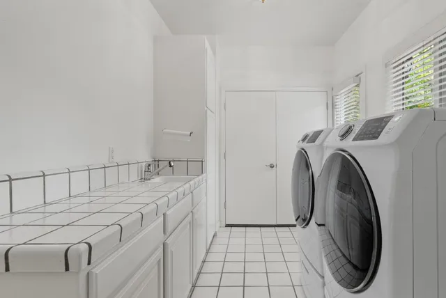 a view of backyard with a garden and entertaining space