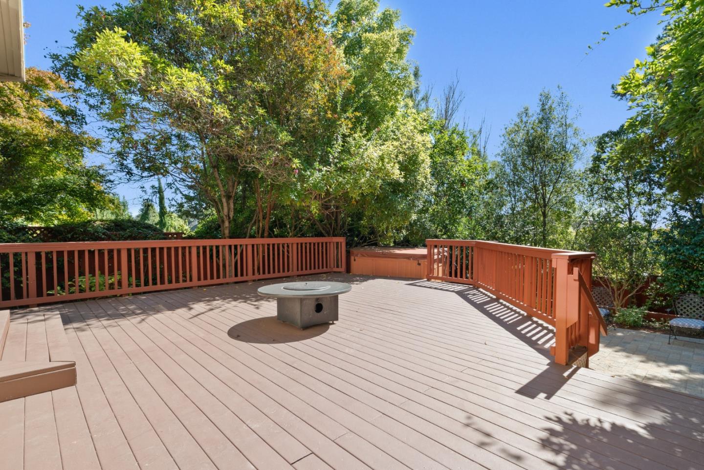 210 Moore Creek Road Santa Cruz, CA 95060 - Photo 44 of 63 a balcony with wooden floor table and chairs