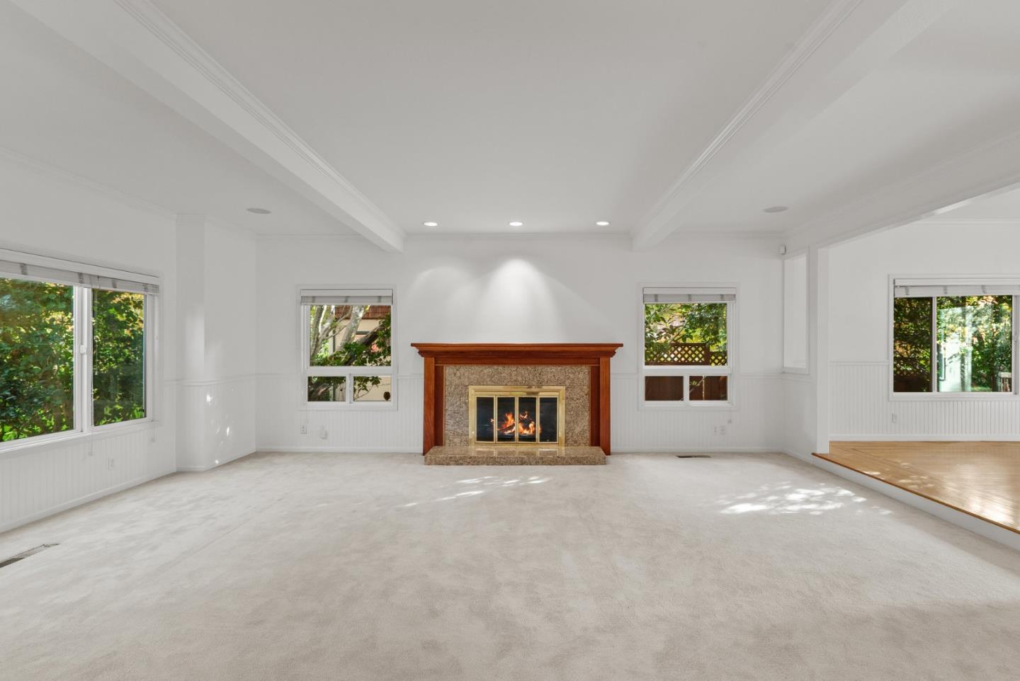 210 Moore Creek Road Santa Cruz, CA 95060 - Photo 5 of 63 an empty room with windows and fireplace