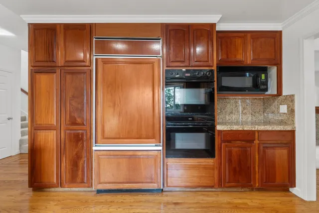 a view of a kitchen with a dishwasher cabinets and a chandelier