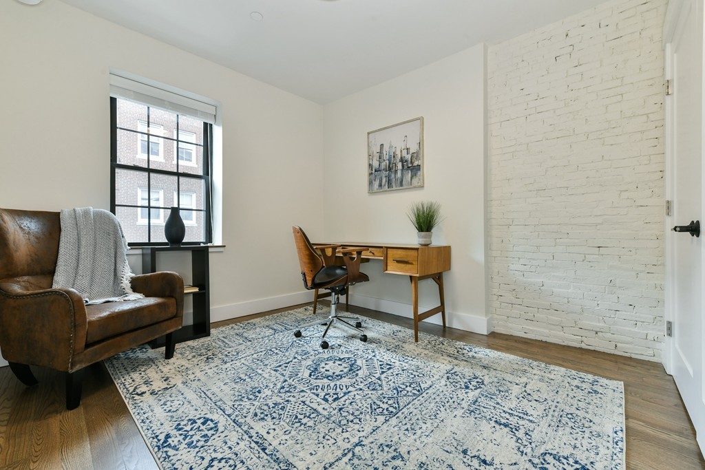 40 Fleet Street, Unit 5 Boston, MA 02113 - Photo 4 of 8 a living room with furniture and a window