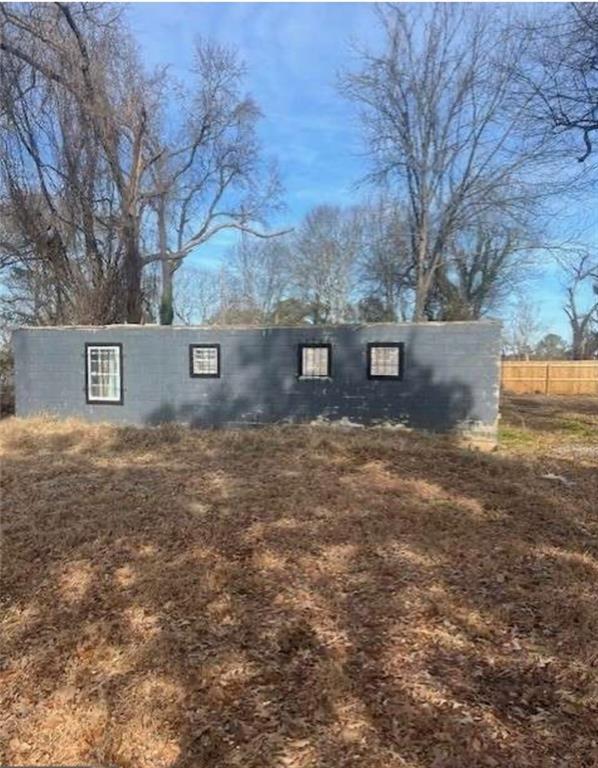 a view of house with yard