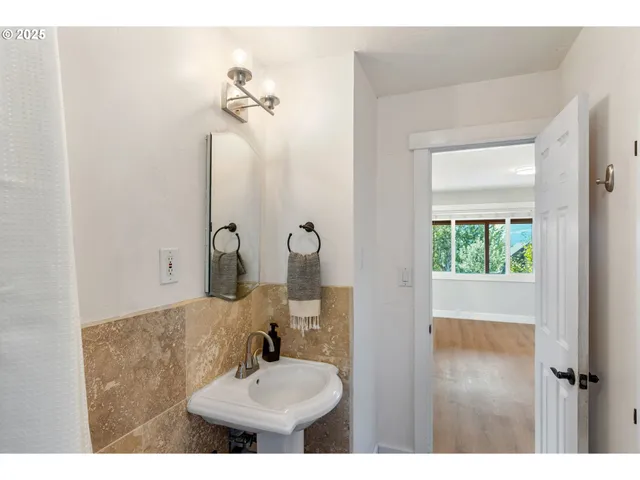 a utility room with cabinets washer and dryer