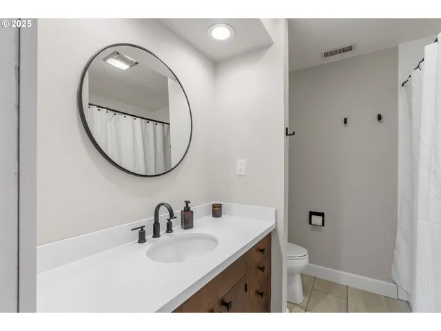 a kitchen with stainless steel appliances granite countertop a sink dishwasher stove and cabinets