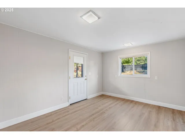a view of a house with a yard and sitting area