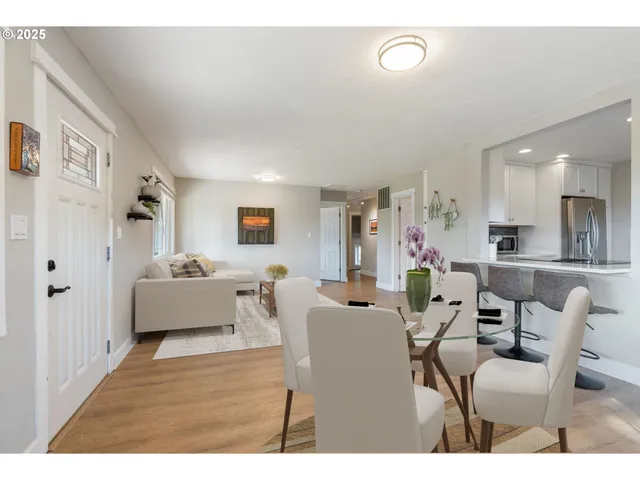 a kitchen with stainless steel appliances a refrigerator sink and cabinets