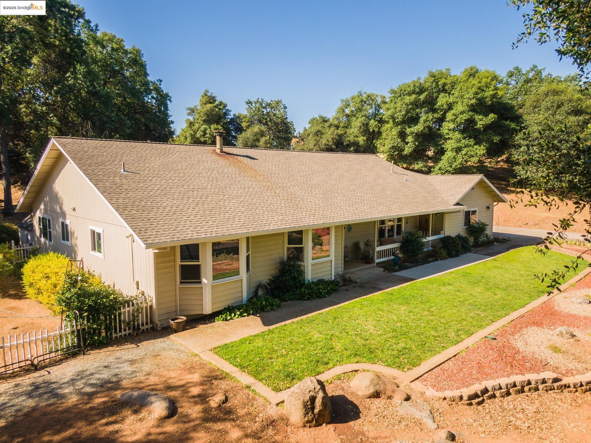 a aerial view of a house with a yard