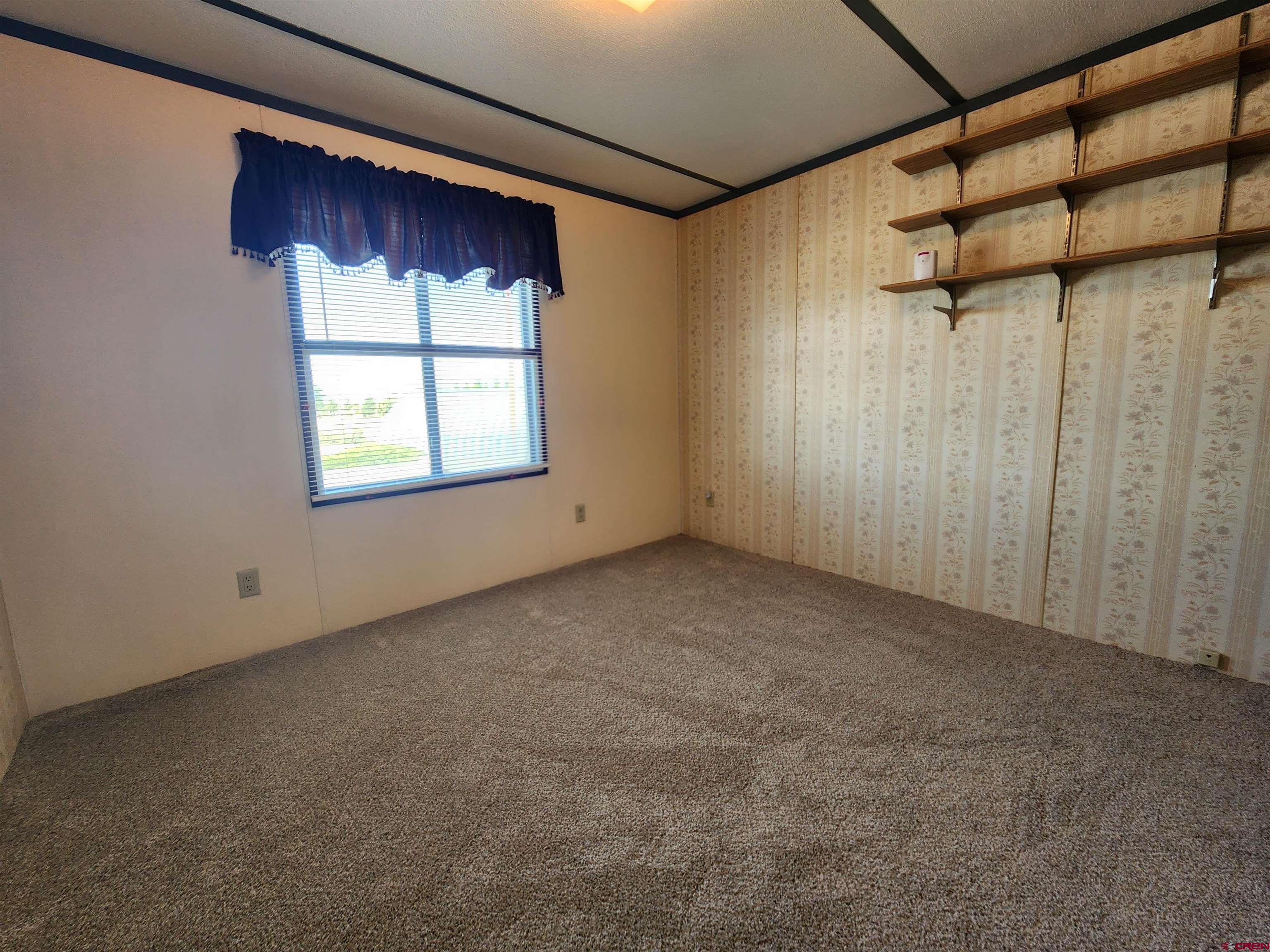 5280 6200th Road Olathe, CO 81425 - Photo 14 of 22 a view of a window in an empty room