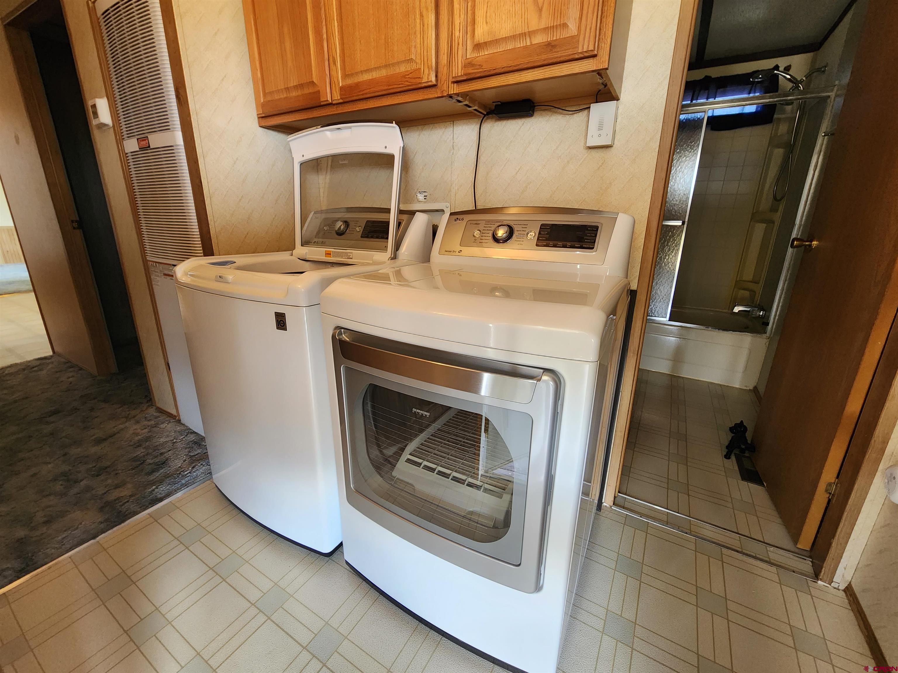 5280 6200th Road Olathe, CO 81425 - Photo 19 of 22 a utility room with dryer and washer