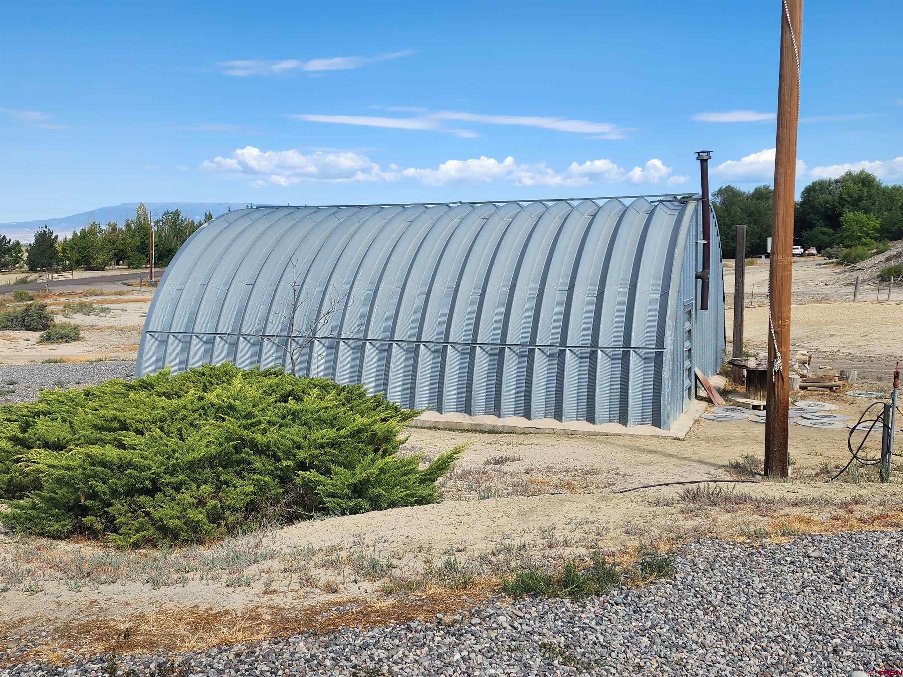 5280 6200th Road Olathe, CO 81425 - Photo 2 of 22 a view of a backyard with pathway