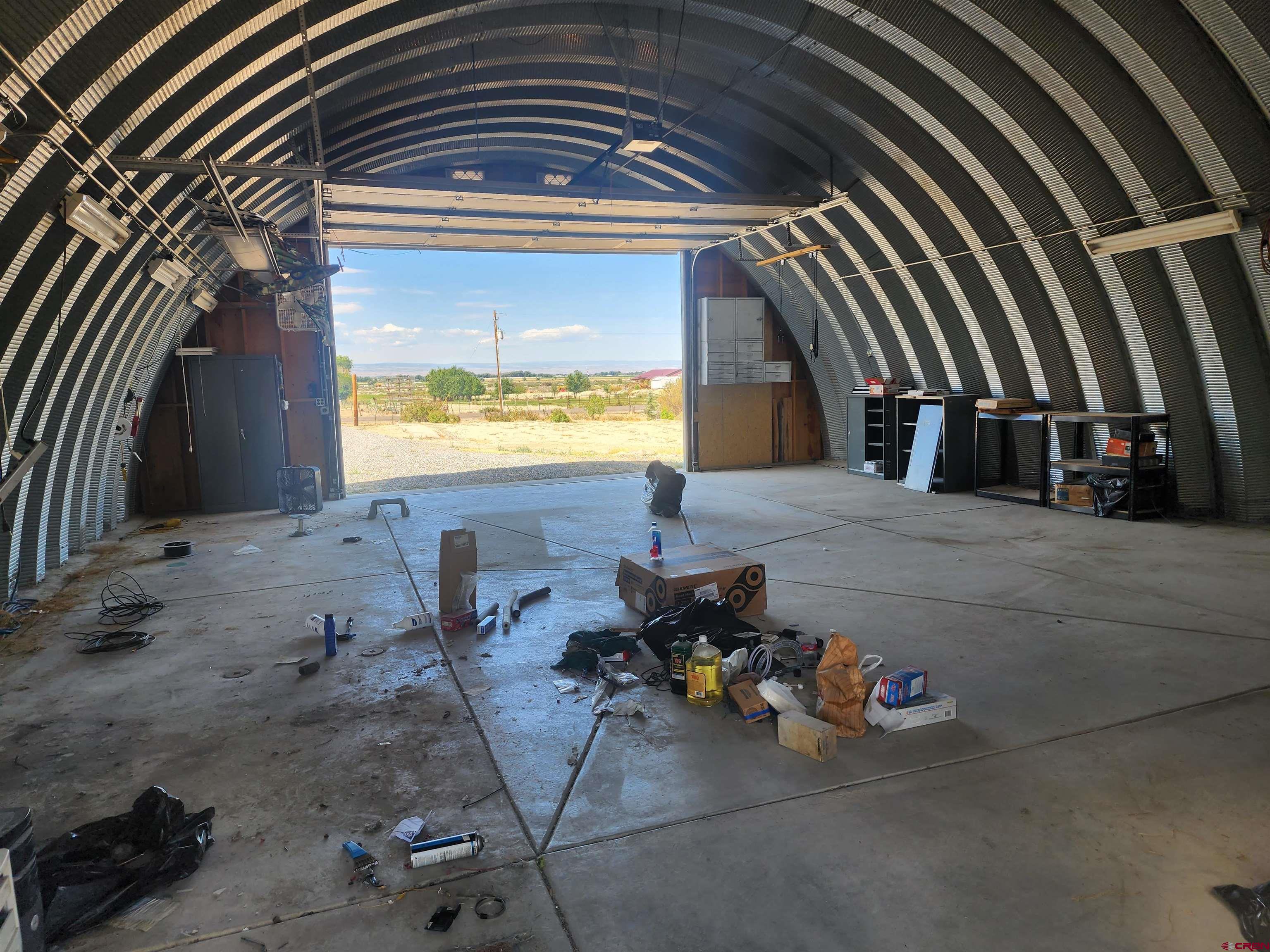 5280 6200th Road Olathe, CO 81425 - Photo 4 of 22 a view of a porch with two chairs and a potted plant