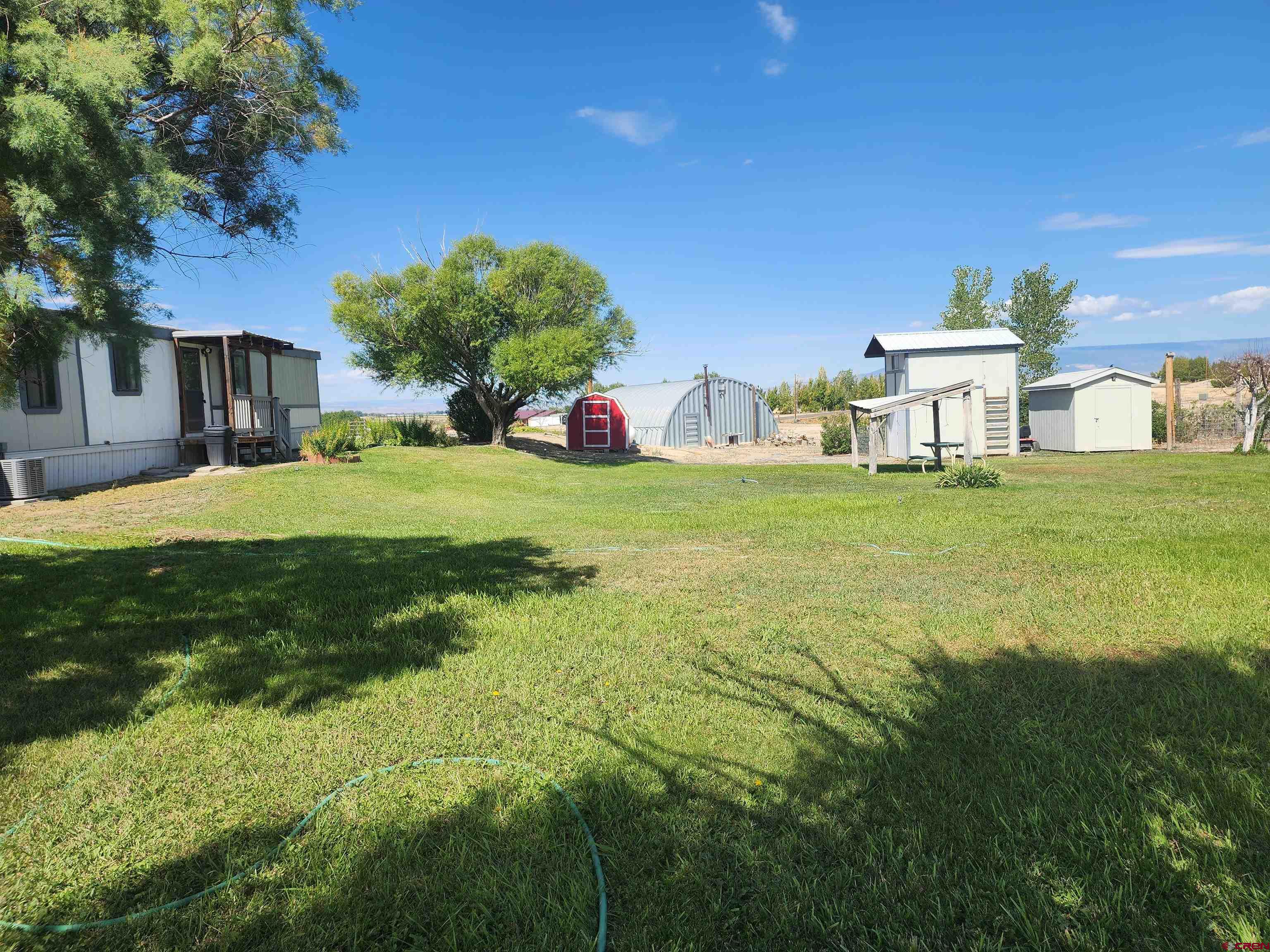 5280 6200th Road Olathe, CO 81425 - Photo 7 of 22 a house view with a outdoor space