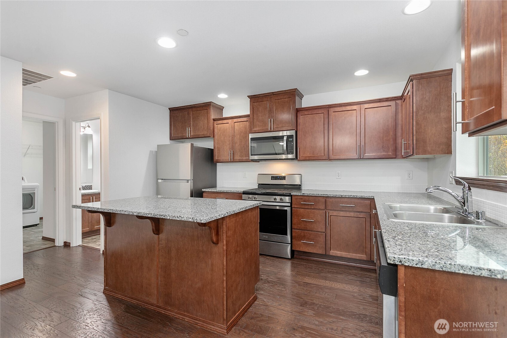 4305 Sumac Lane Bellingham, WA 98226 - Photo 11 of 38 a kitchen with stainless steel appliances granite countertop a sink stove and refrigerator