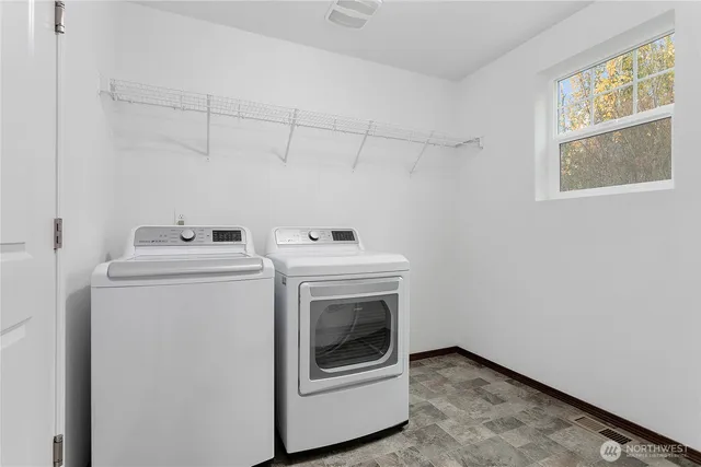 a utility room with dryer and washer
