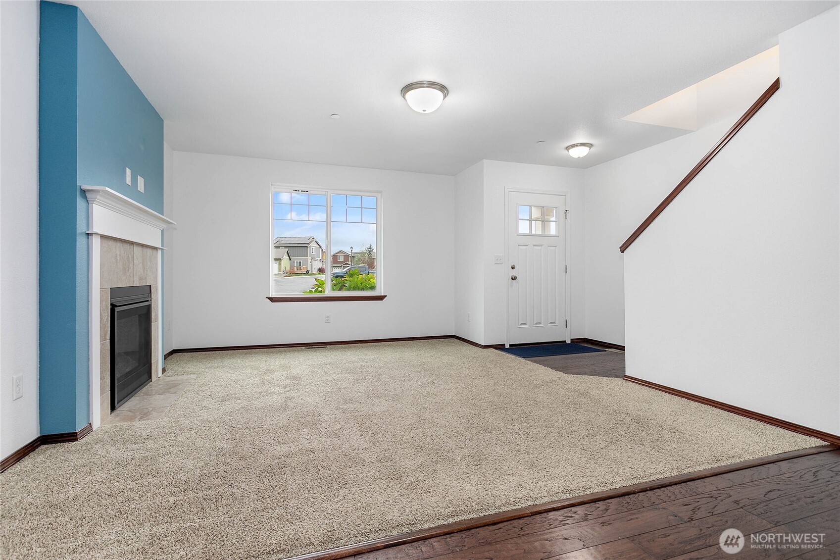 4305 Sumac Lane Bellingham, WA 98226 - Photo 19 of 38 an empty room with windows and fireplace