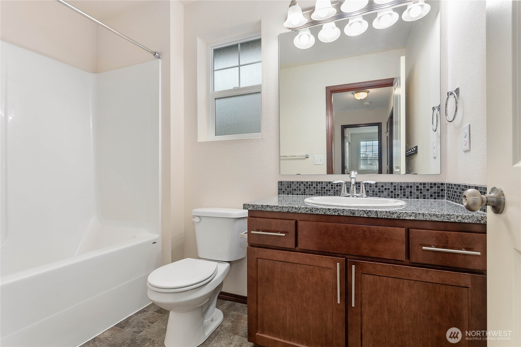 4305 Sumac Lane Bellingham, WA 98226 - Photo 22 of 38 a bathroom with a granite countertop toilet sink and mirror