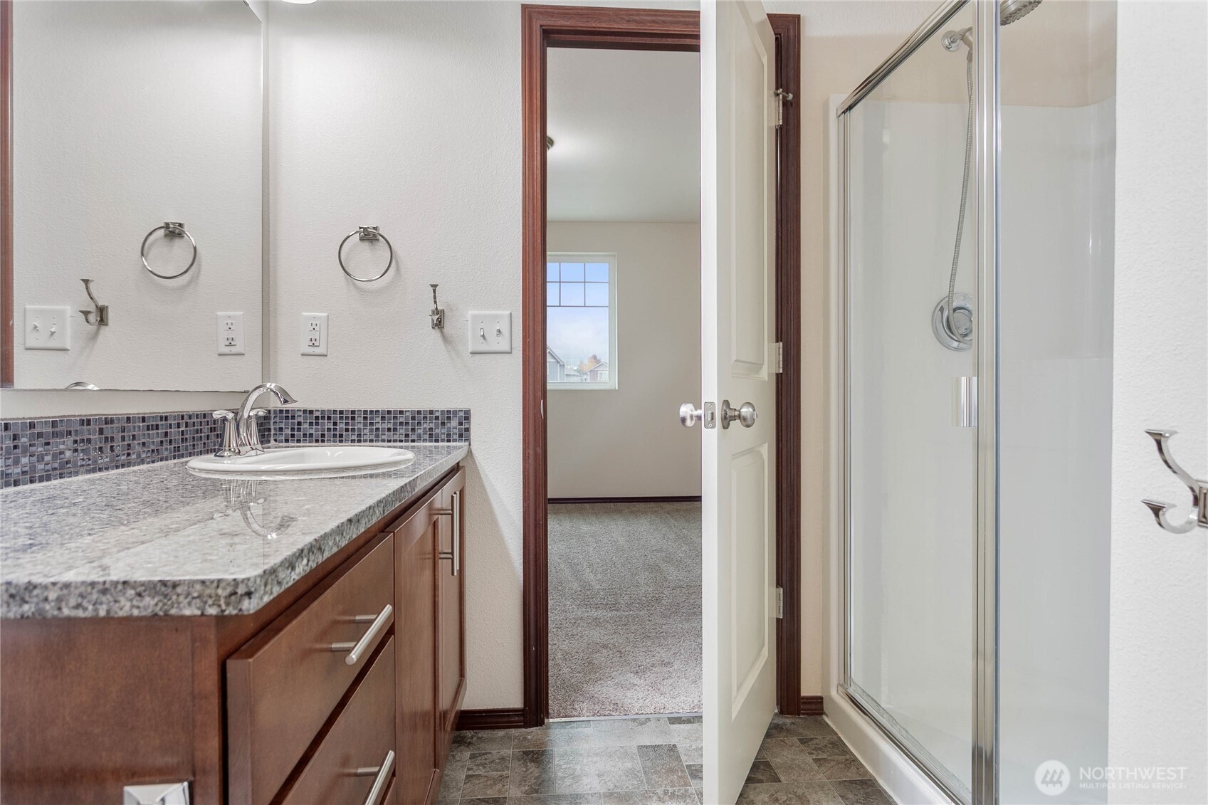 4305 Sumac Lane Bellingham, WA 98226 - Photo 30 of 38 a bathroom with a granite countertop sink and a mirror