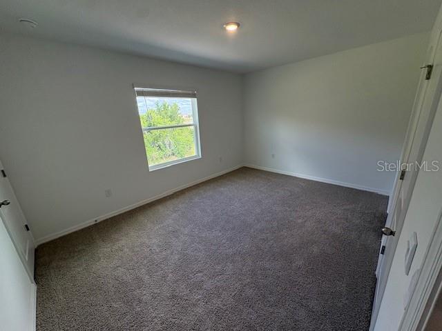 32547 Welling Blade Loop Wesley Chapel, FL 33545 - Photo 13 of 21 an empty room with windows