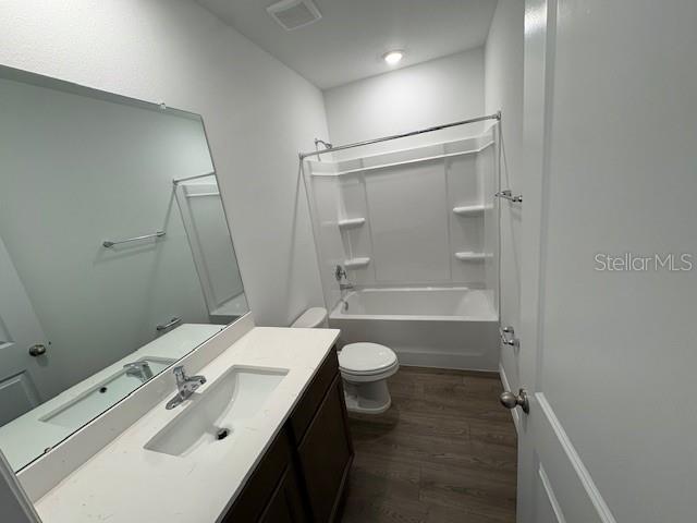 32547 Welling Blade Loop Wesley Chapel, FL 33545 - Photo 14 of 21 a bathroom with a sink a toilet and shower